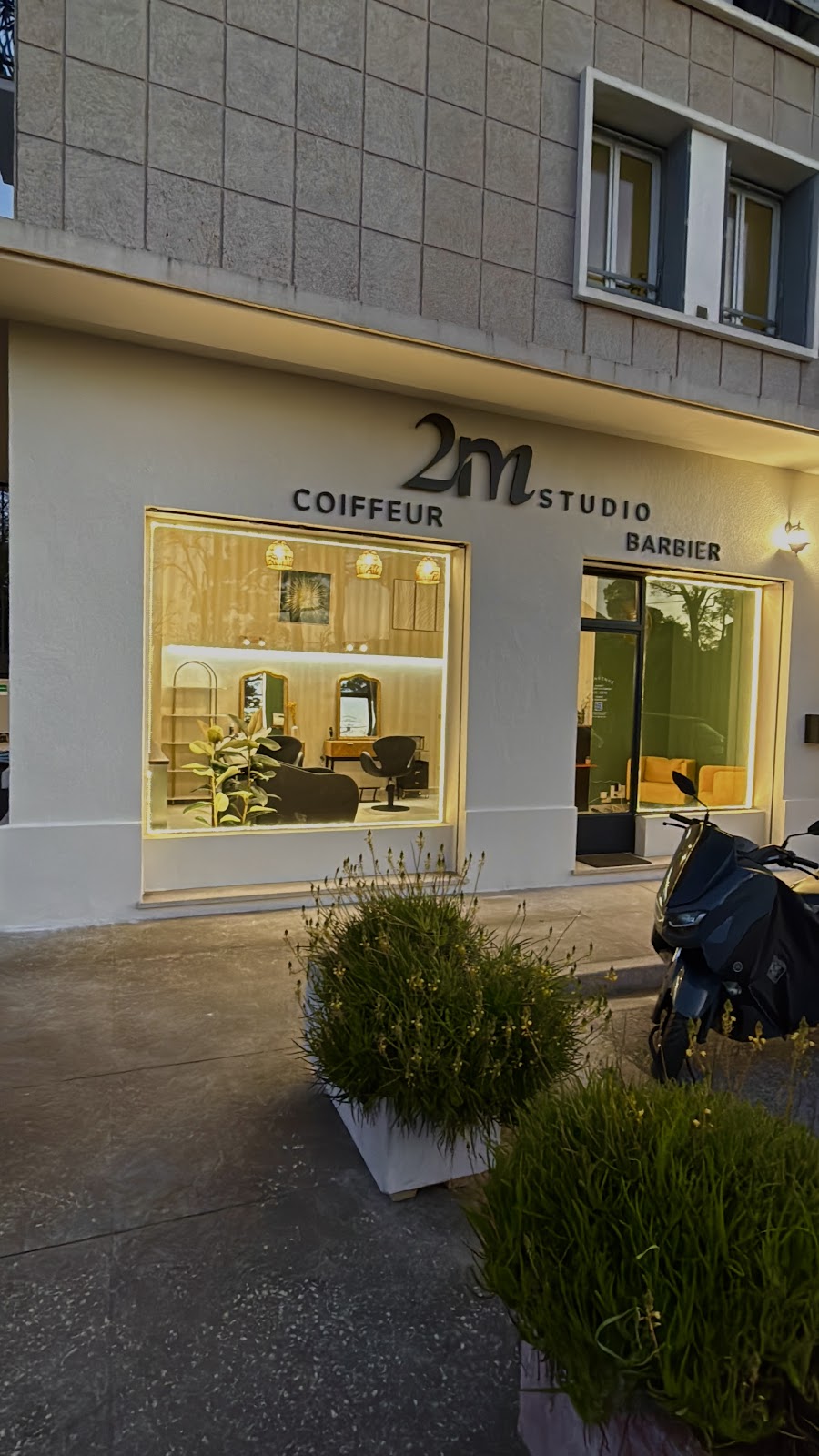 Storefront at night with warm lighting in the windows