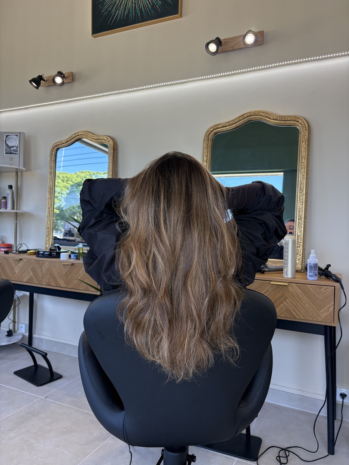 Salon workspace with a styling station and mirrors